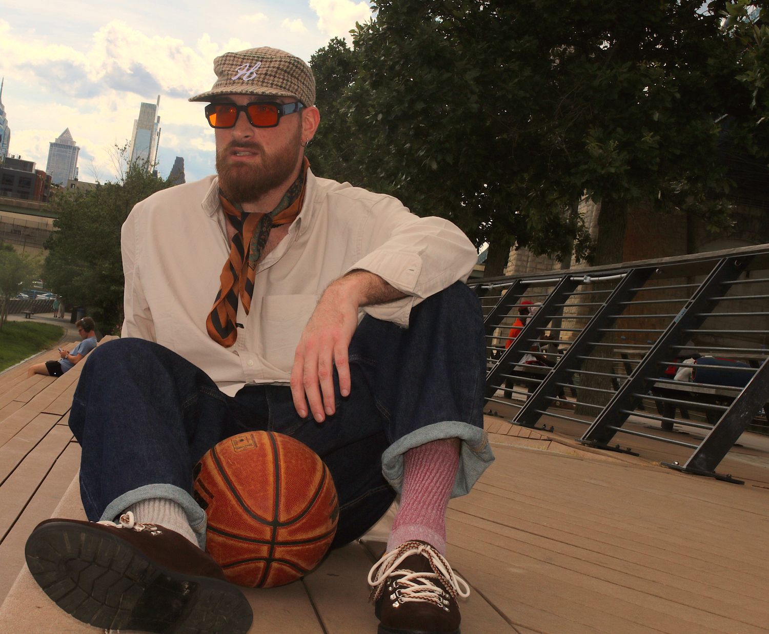Sitting streetside in the Umber pair, city skyline behind