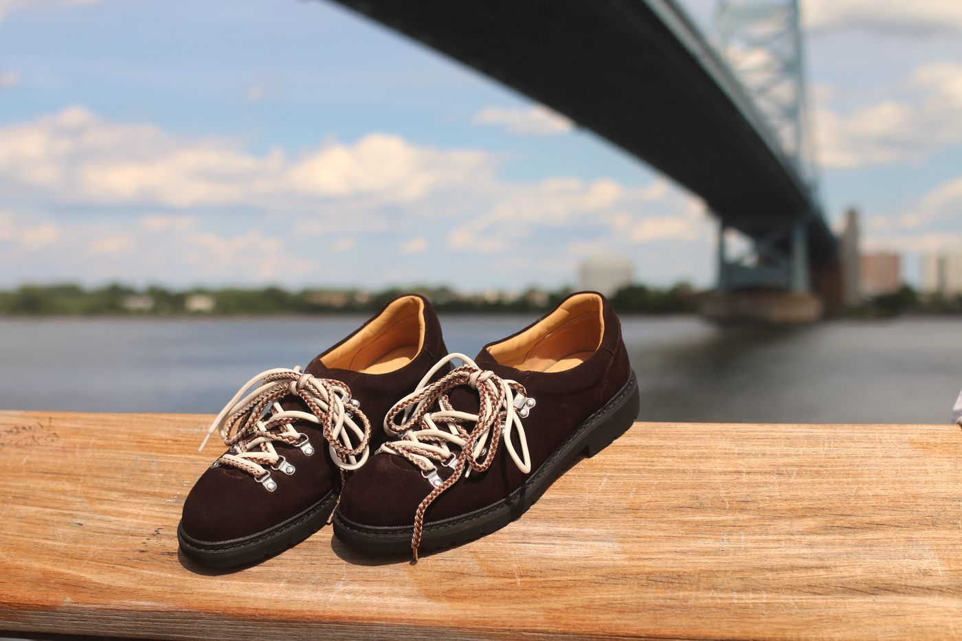 Umber pair on a railing by the river